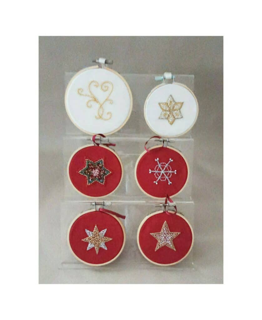 Hand beaded on silk. Bamboo embroidery hoops with silk hanging ribbons.